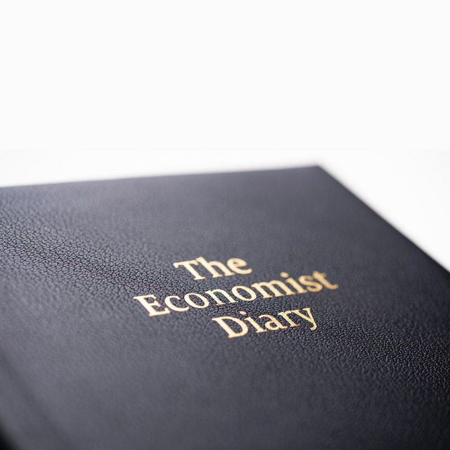 The Economist - 2027 Calendar Year Planner –  12 Month (260 x 210mm) Day-to-Page Diary – Luxury Leather Cover in Blue - The Economist Desk Diary Range (EPADBLU-27)